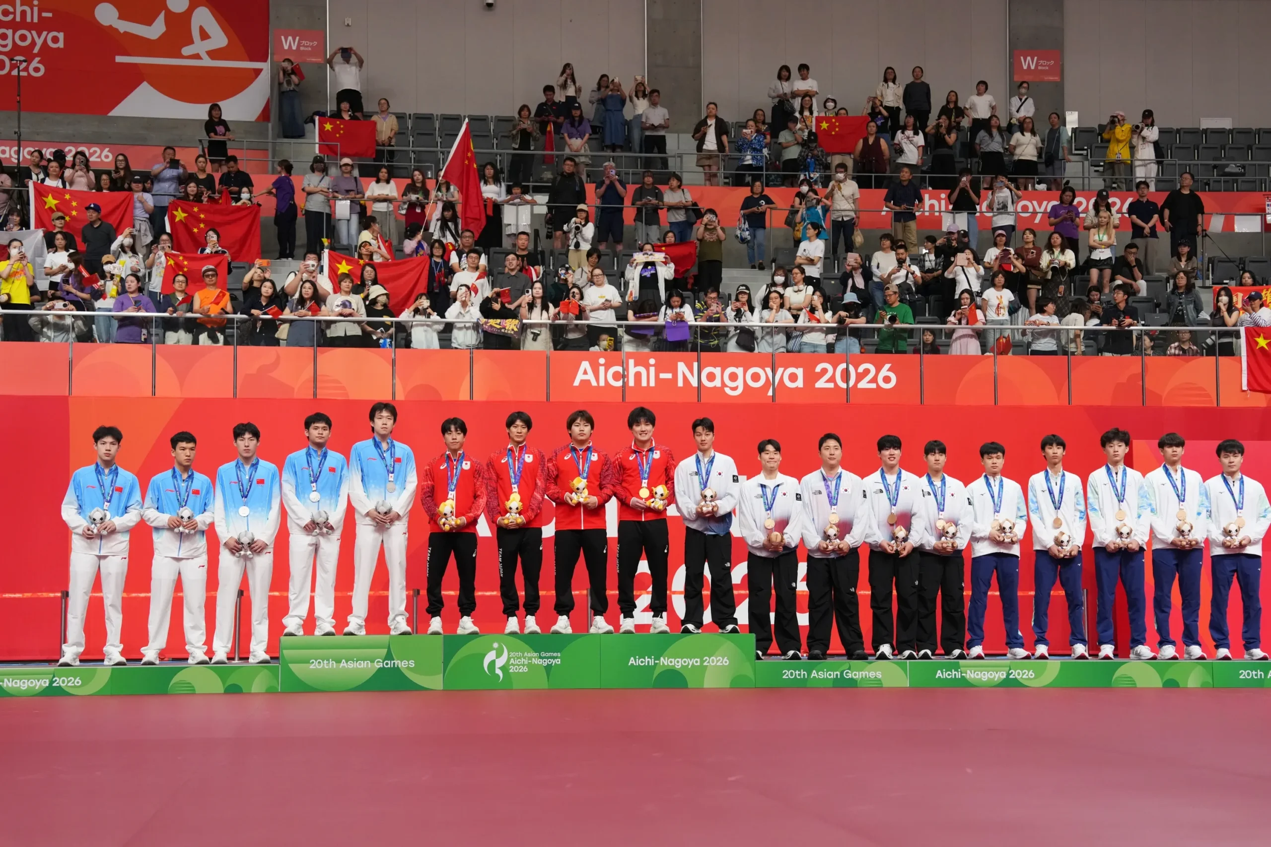 Men’s team medal ceremony at the 2026 Aichi-Nagoya Asian Games, with China taking silver, Japan gold, and South Korea and Chinese Taipei bronze.
